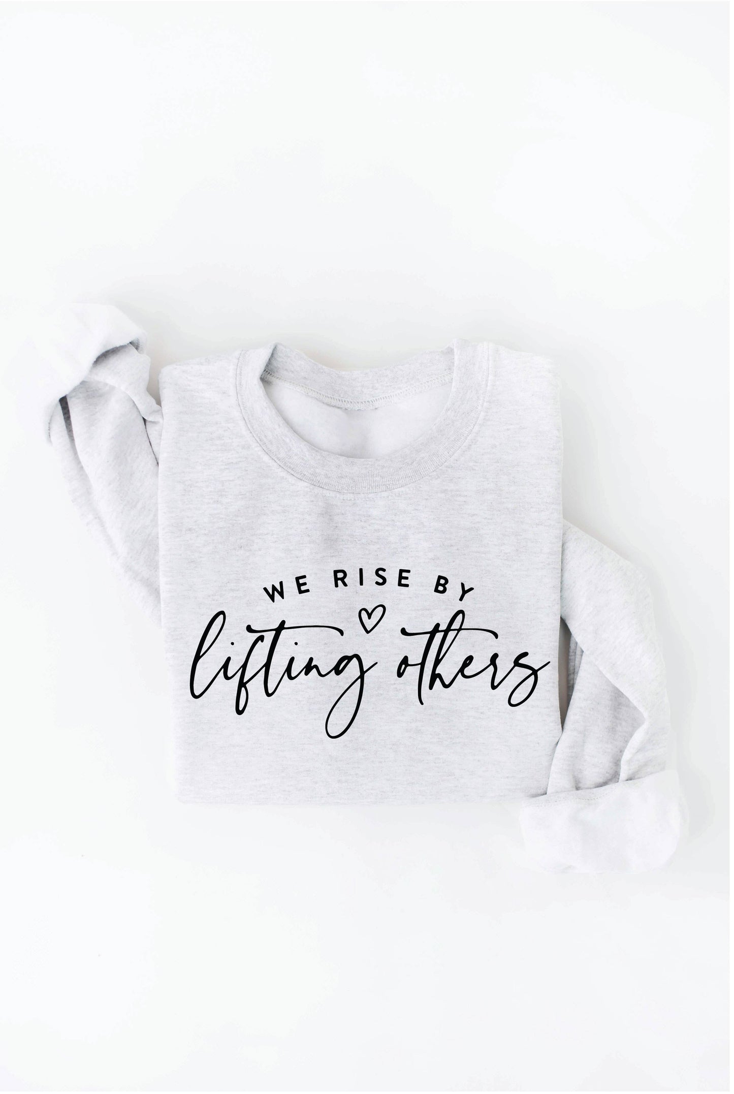 WE RISE BY LIFTING OTHERS  Graphic Sweatshirt: BLACK / S
